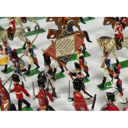 231 - A large collection of assorted hand painted metal toy soldiers to include; Highland Pipers, French C... 