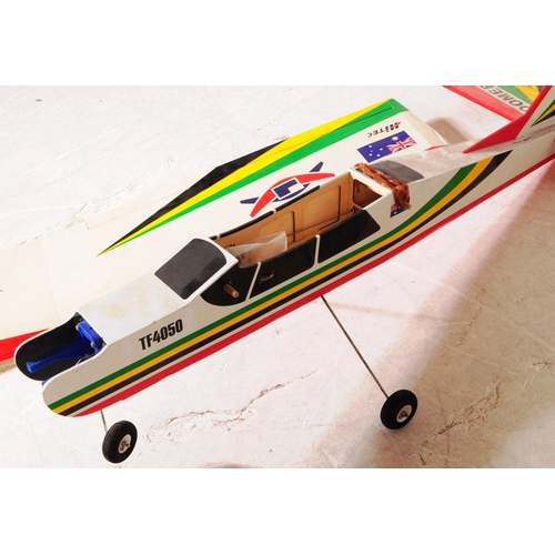 279 - Radio Controlled Plane - a vintage model RC plane fuselage and wings. Wooden construction decorated ... 