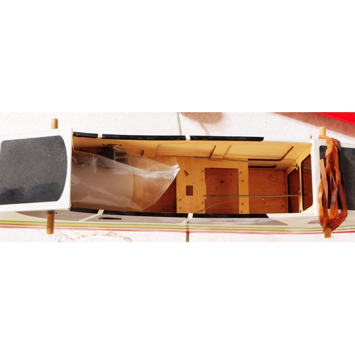 279 - Radio Controlled Plane - a vintage model RC plane fuselage and wings. Wooden construction decorated ... 