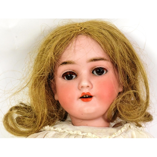 280 - An early 20th Century German ' Kley & Hahn ' bisque headed doll . Brown flirty eyes, finely panted b... 