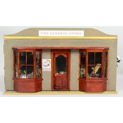 281 - Doll House - a hand made scratch built front opening wooden dolls house in the form of a general sho... 