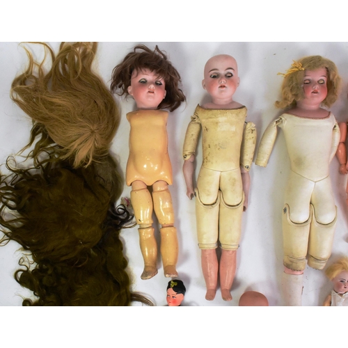 330 - Dolls - a collection of assorted German and French bisque headed dolls, parts / spares repairs to in... 