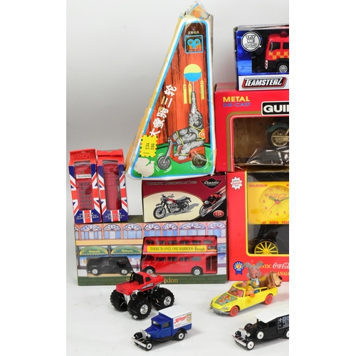 345 - A collection of assorted toys and games to include; tinplate models (bird in a shell, elephant on bi... 