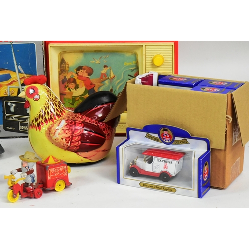 345 - A collection of assorted toys and games to include; tinplate models (bird in a shell, elephant on bi... 