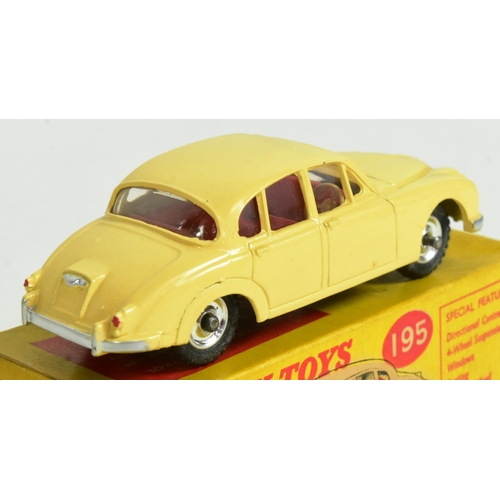 346 - Diecast - an original vintage Dinky Toys boxed diecast model No. 195 Jaguar 3.4 Saloon. Cream with r... 