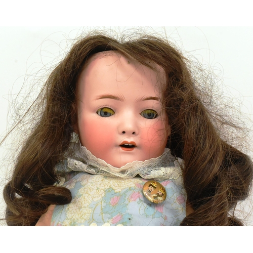 363 - An early 20th Century German Heubach Koppelsdorf made bisque headed doll. Blue fixed eyes, finely pa... 