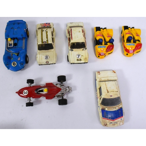 371 - Scalextric - a collection of vintage Scalextric cars (spares / repairs) together with a selection of... 