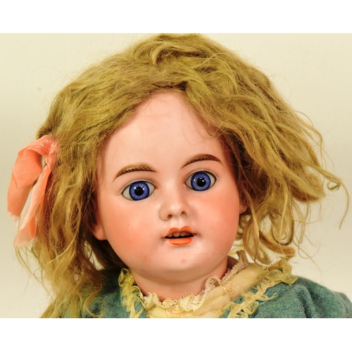 380 - An early 20th Century German Armand Marseille bisque headed doll. Blue fixed eyes, finely painted br... 