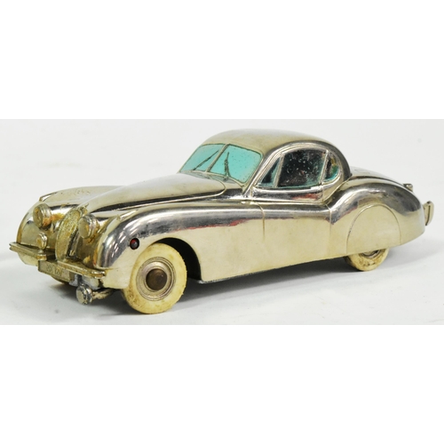 42 - A vintage 1950s German made (Prameta) chrome metal windup clockwork model Jaguar XK 120. Mechanism i... 