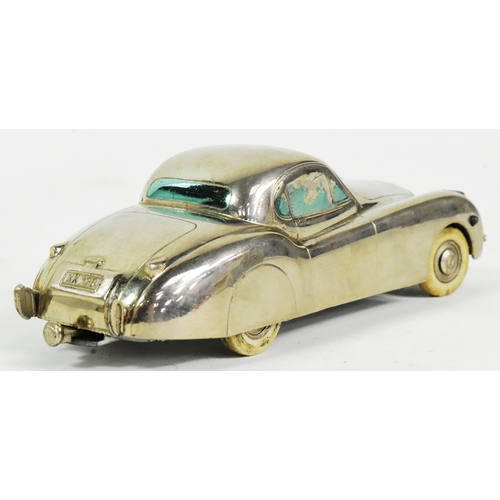 42 - A vintage 1950s German made (Prameta) chrome metal windup clockwork model Jaguar XK 120. Mechanism i... 