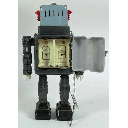 410 - Tinplate Toys - a vintage Japanese (Alps) tinplate battery operated Television Spaceman robot. Untes... 