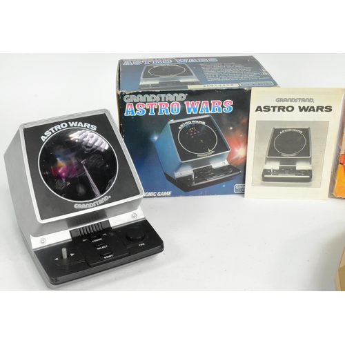 426 - Retro Gaming - x2 vintage tabletop / hand held video game consoles comprising Grandstand Astro Wars ... 