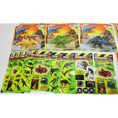 509 - A collection of vintage childrens rack pack toys and sticks comprising x12 Dragon Toys windup dinosa... 