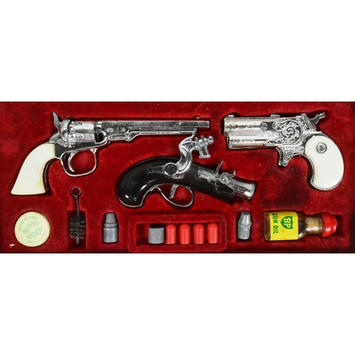 521 - A vintage 1960s BCM Company (Derby) Outlaw Presentation Case of Miniature Antique Firearms. The set ... 