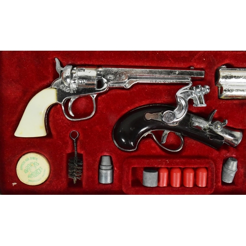 521 - A vintage 1960s BCM Company (Derby) Outlaw Presentation Case of Miniature Antique Firearms. The set ... 