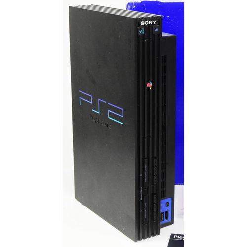 526 - Retro Gaming - an original Sony PS2 Playstation 2 video game console together with controllers and P... 