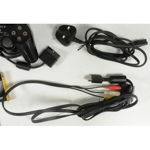 526 - Retro Gaming - an original Sony PS2 Playstation 2 video game console together with controllers and P... 