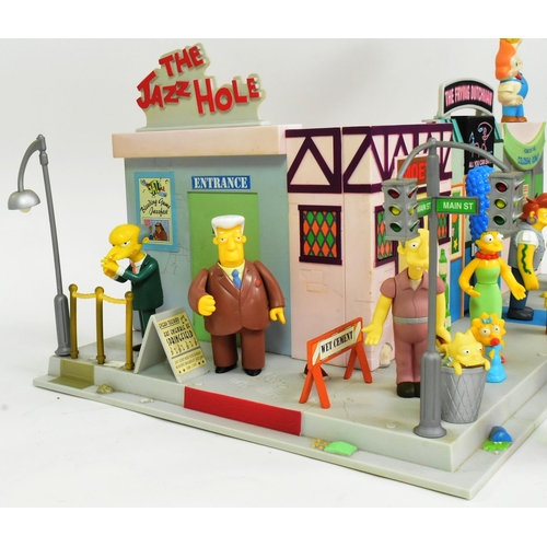 542 - The Simpsons - Playmates - a Simpsons 'Main Street' interactive playset, featuring the main street a... 