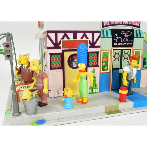 542 - The Simpsons - Playmates - a Simpsons 'Main Street' interactive playset, featuring the main street a... 