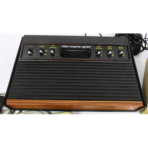 587 - Retro Gaming - a collection of vintage video game consoles comprising; 1980s Commodore 64 / C64 home... 