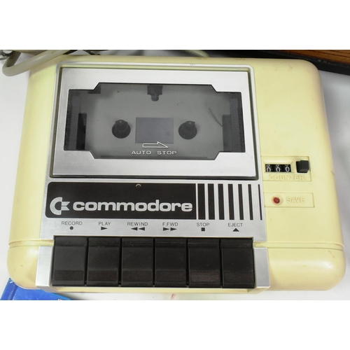 587 - Retro Gaming - a collection of vintage video game consoles comprising; 1980s Commodore 64 / C64 home... 