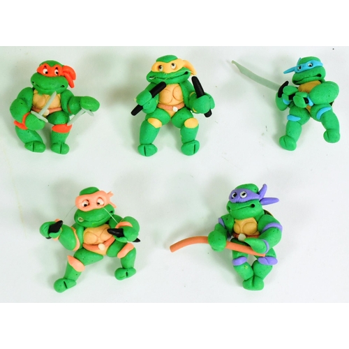 589 - Ninja Turtles - a collection of vintage TMNT Teenage Mutant Ninja Turtles French issued toy memorabi... 