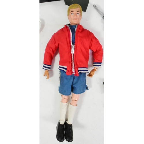 597 - Action Man - a vintage 1970s Palitoy Action Man footballer with additional Helicopter uniform, Assau... 