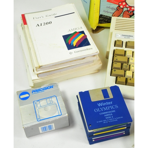 610 - Retro Gaming - a vintage 1990s Commodore Amiga 1200 Desktop Dynamite 32-bit home computer. Boxed wit... 