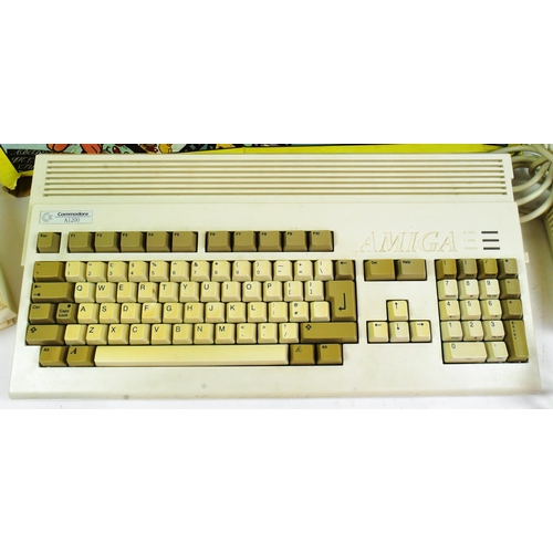 610 - Retro Gaming - a vintage 1990s Commodore Amiga 1200 Desktop Dynamite 32-bit home computer. Boxed wit... 