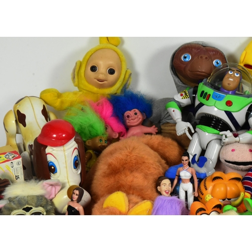 624 - A large collection of assorted vintage toys, including action figures and dolls, featuring from bran... 