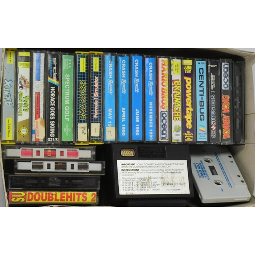 634 - Retro Gaming - a vintage 1980s Sinclair ZX Spectrum gaming console, joystick and a quantity of origi... 