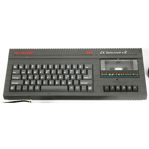 634 - Retro Gaming - a vintage 1980s Sinclair ZX Spectrum gaming console, joystick and a quantity of origi... 