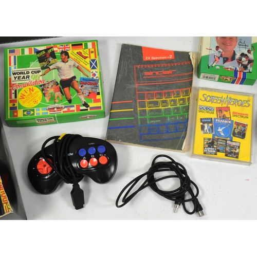 634 - Retro Gaming - a vintage 1980s Sinclair ZX Spectrum gaming console, joystick and a quantity of origi... 