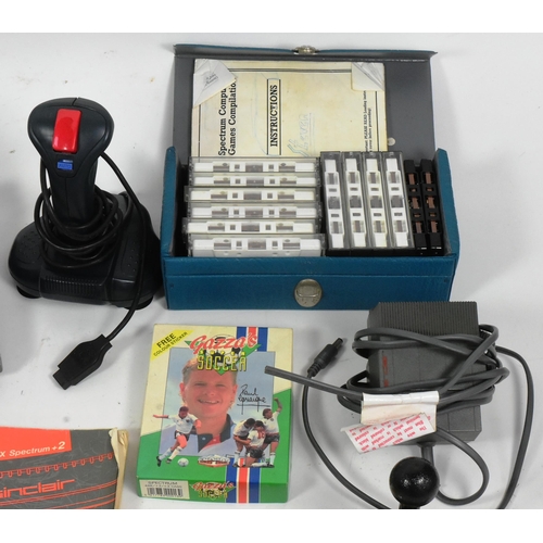 634 - Retro Gaming - a vintage 1980s Sinclair ZX Spectrum gaming console, joystick and a quantity of origi... 