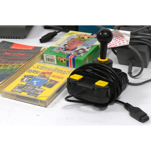 634 - Retro Gaming - a vintage 1980s Sinclair ZX Spectrum gaming console, joystick and a quantity of origi... 