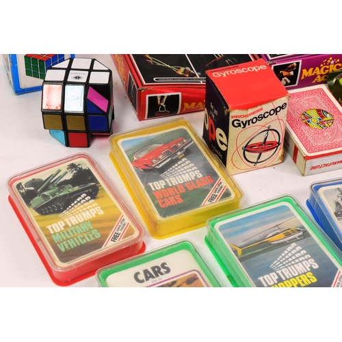 727 - Retro Toys - a selection of vintage c1970s toys and playsets to include several sets of Top Trumps c... 