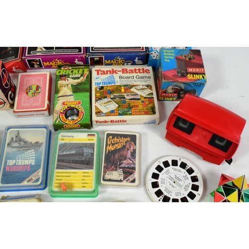 727 - Retro Toys - a selection of vintage c1970s toys and playsets to include several sets of Top Trumps c... 