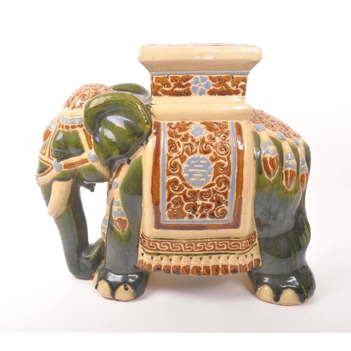 19 - Large green majolica style Indian elephant with pedestal with a square pedestal to its back above pi... 