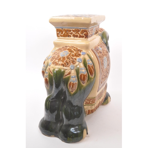 19 - Large green majolica style Indian elephant with pedestal with a square pedestal to its back above pi... 