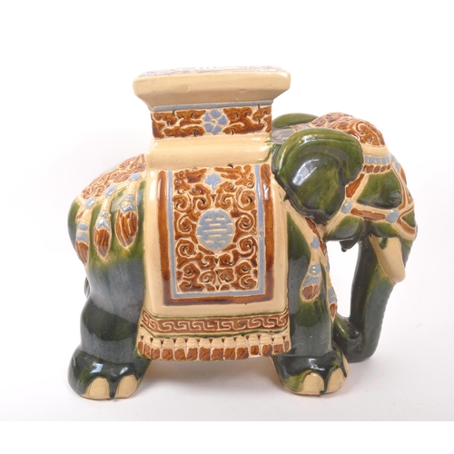 19 - Large green majolica style Indian elephant with pedestal with a square pedestal to its back above pi... 