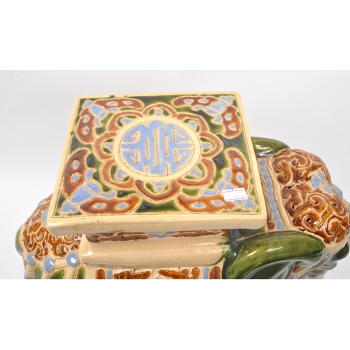 19 - Large green majolica style Indian elephant with pedestal with a square pedestal to its back above pi... 