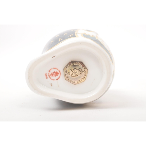 22 - Royal Crown Derby - Contemporary-Paper weight in the form of a penguin. Gilt stopper and makers mark... 