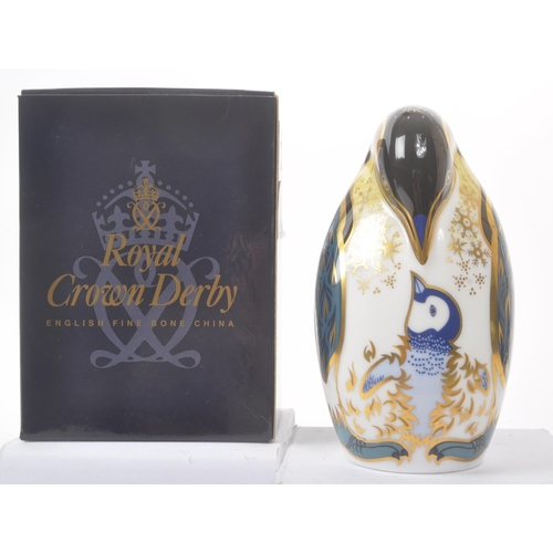 22 - Royal Crown Derby - Contemporary-Paper weight in the form of a penguin. Gilt stopper and makers mark... 