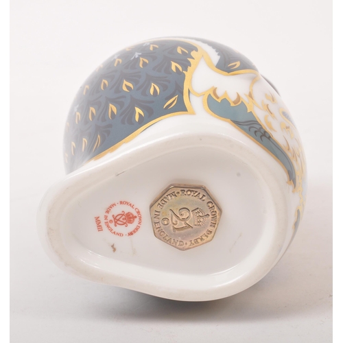 22 - Royal Crown Derby - Contemporary-Paper weight in the form of a penguin. Gilt stopper and makers mark... 