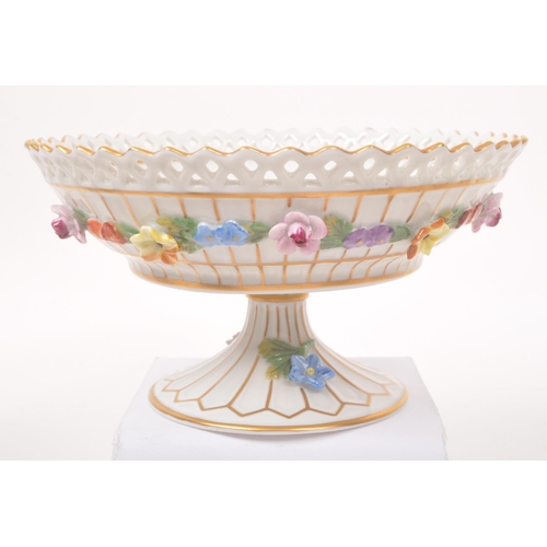 25 - Dresden - A collection of late 20th century Dresden porcelain figurines, candle sticks and bowl with... 