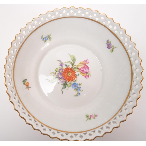 25 - Dresden - A collection of late 20th century Dresden porcelain figurines, candle sticks and bowl with... 