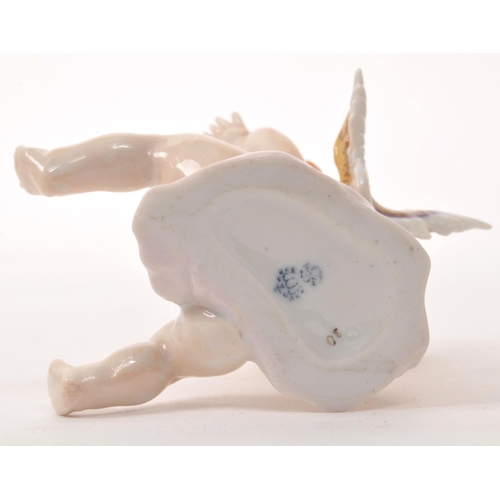 25 - Dresden - A collection of late 20th century Dresden porcelain figurines, candle sticks and bowl with... 