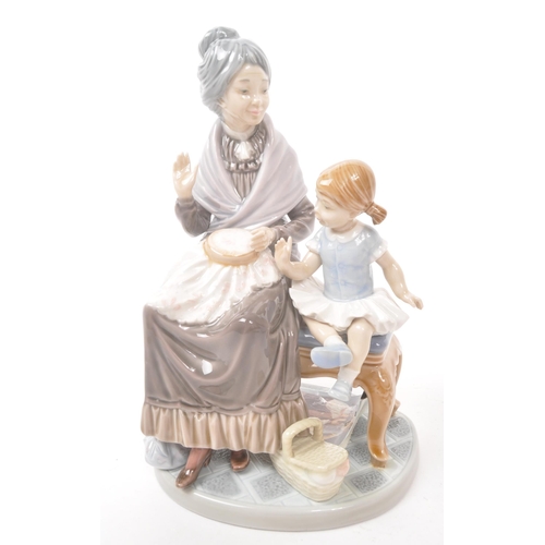 29 - Lladro - Late 20th century Spanish porcelain figurines. A ballroom lady with delicate decorated fan ... 