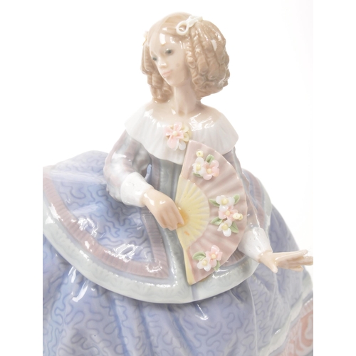 29 - Lladro - Late 20th century Spanish porcelain figurines. A ballroom lady with delicate decorated fan ... 