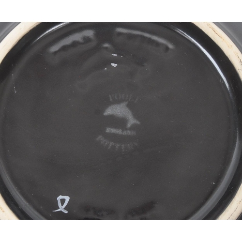 31 - Poole Pottery - A forest flame purse table top vase, together with matching pattern large wall / dis... 